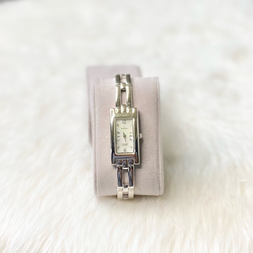 •Peugeot• platinum plated link watch